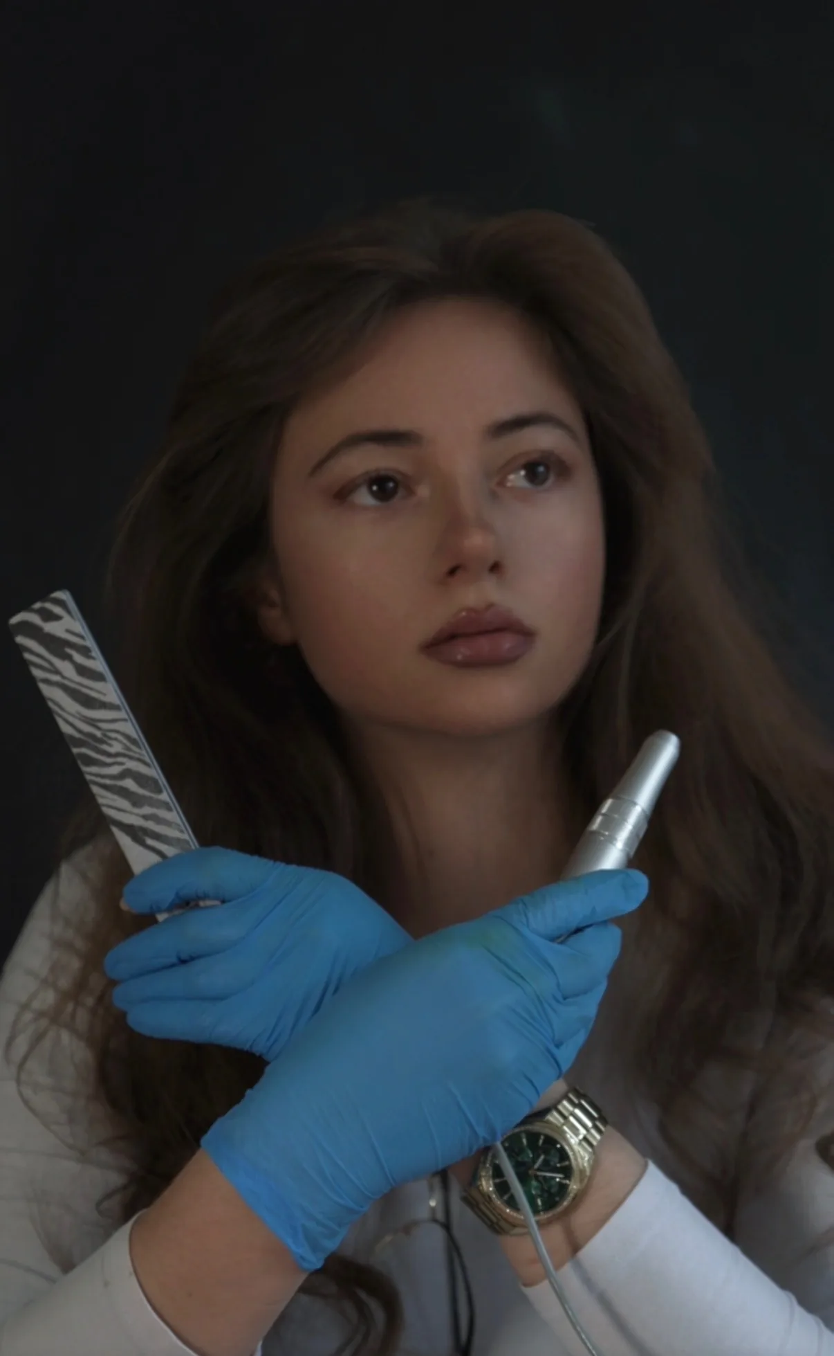 Patricia from Patricia Nails Academy holding professional nail tools